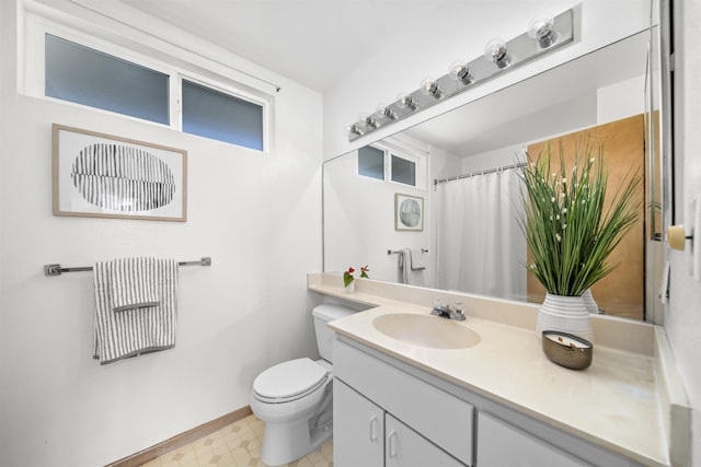 bathroom with toilet and vanity