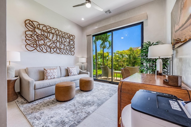 living room featuring ceiling fan and light tile patterned flooring