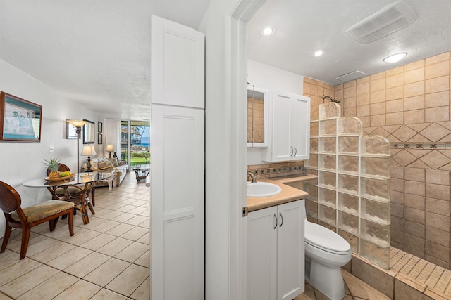 3975 Lower Honoapiilani Rd Unit 107, Lahaina, HI 96761 - full bath featuring walk in shower, vanity, recessed lighting, toilet, and tile patterned flooring