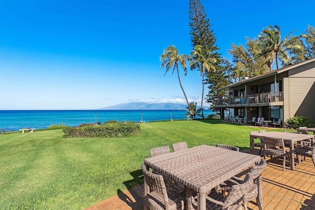 3975 Lower Honoapiilani Rd Unit 107, Lahaina, HI 96761 - view of grassy yard with outdoor dining area and a water view
