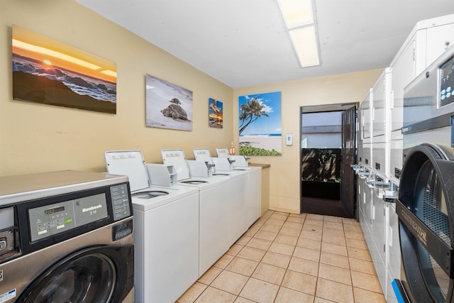 3975 Lower Honoapiilani Rd Unit 107, Lahaina, HI 96761 - shared laundry room with stacked washing machine and dryer, washing machine and dryer, and light tile patterned flooring