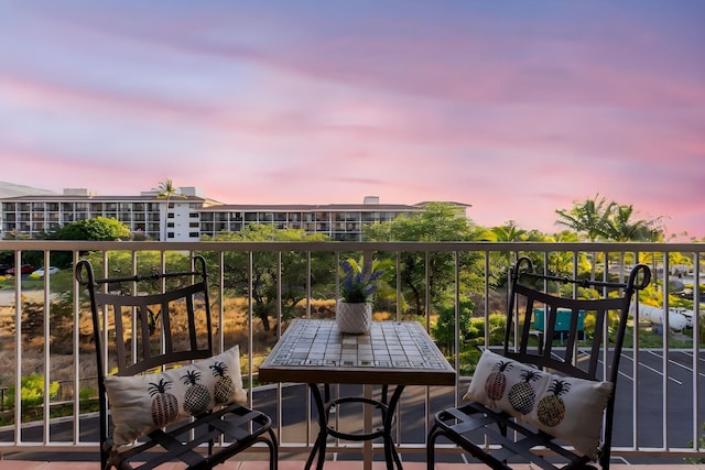 view of balcony at dusk