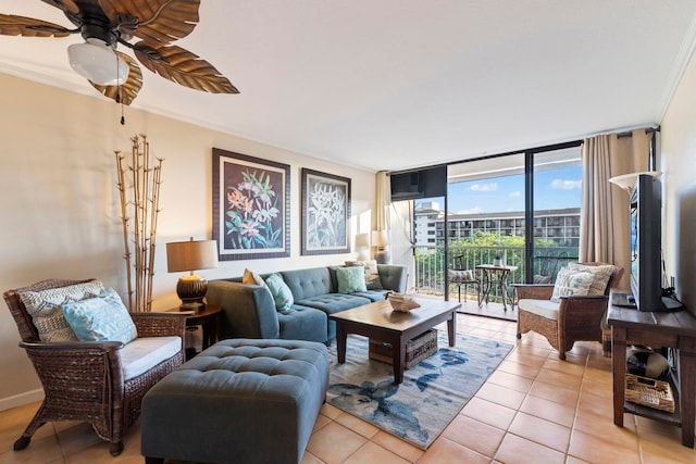 tiled living room with ceiling fan, a wall of windows, and ornamental molding