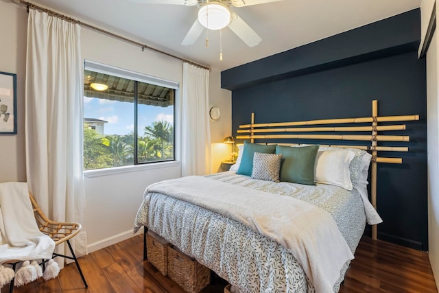 bedroom with ceiling fan and dark hardwood / wood-style flooring