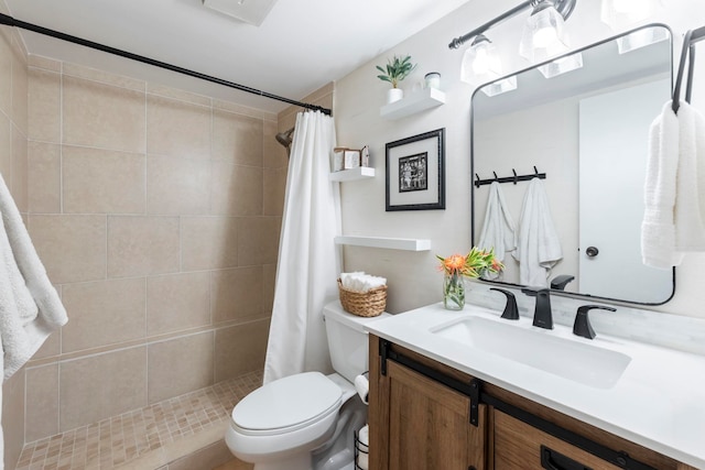 bathroom featuring a shower with shower curtain, vanity, and toilet