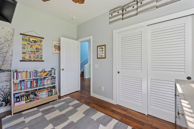 interior space with dark wood-style floors and baseboards