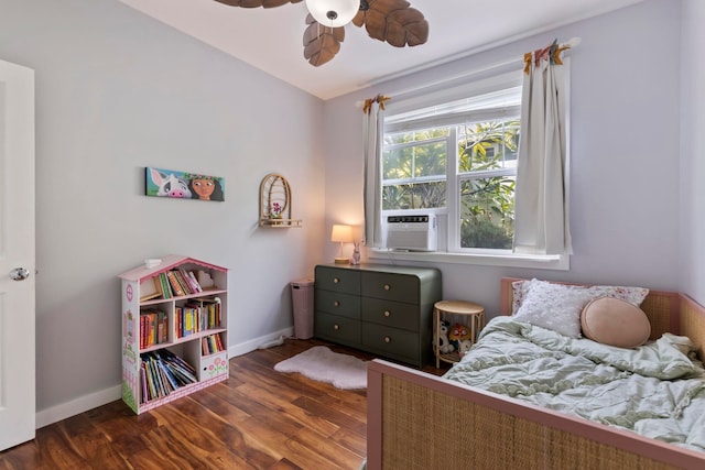 bedroom featuring dark wood-style floors, baseboards, and a ceiling fan