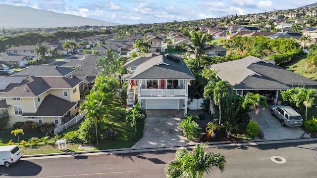 drone / aerial view with a residential view and a mountain view