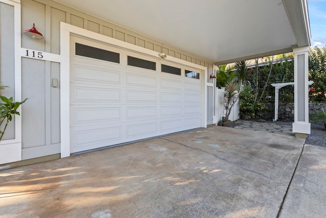 garage featuring driveway