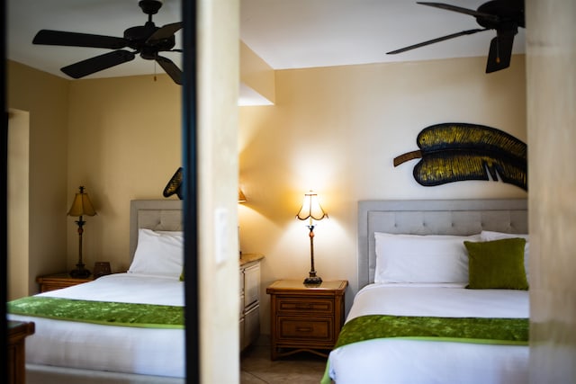 bedroom featuring tile patterned flooring and ceiling fan