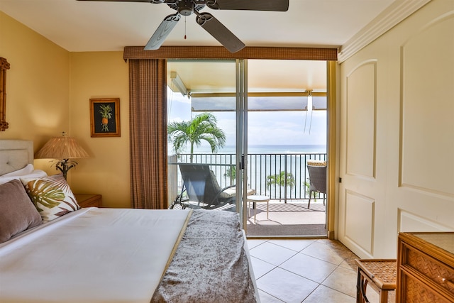 tiled bedroom with a water view, access to exterior, and ceiling fan