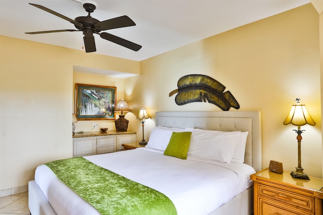 tiled bedroom with ceiling fan