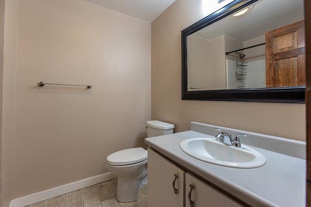2747 S Kihei Rd Unit H208, Kihei, HI 96753 - bathroom featuring toilet, vanity, baseboards, wood finished floors, and a shower