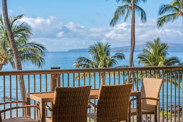 balcony featuring a water view