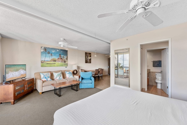 bedroom with ceiling fan, a textured ceiling, access to exterior, and carpet