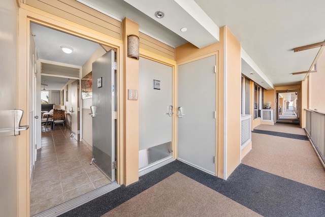 hallway with light tile floors