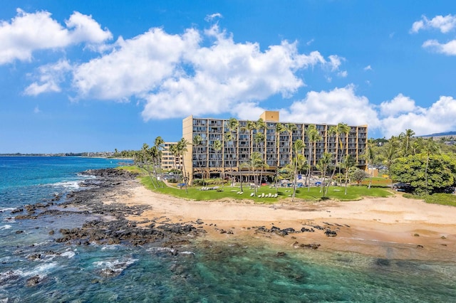 exterior space featuring a water view and a beach view