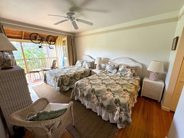 bedroom with dark hardwood / wood-style flooring, ceiling fan, and access to outside