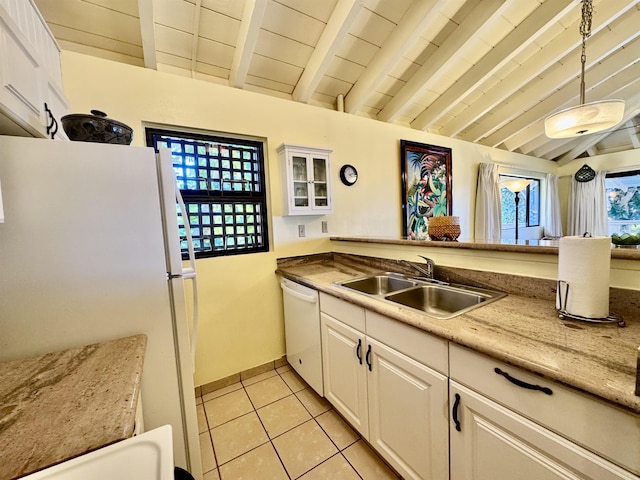 kitchen with pendant lighting, lofted ceiling with beams, white cabinetry, sink, and white appliances