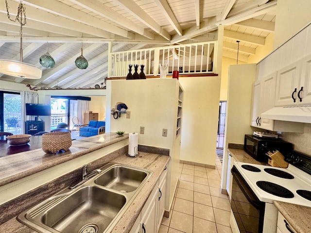 kitchen with pendant lighting, sink, electric range, and light tile patterned floors