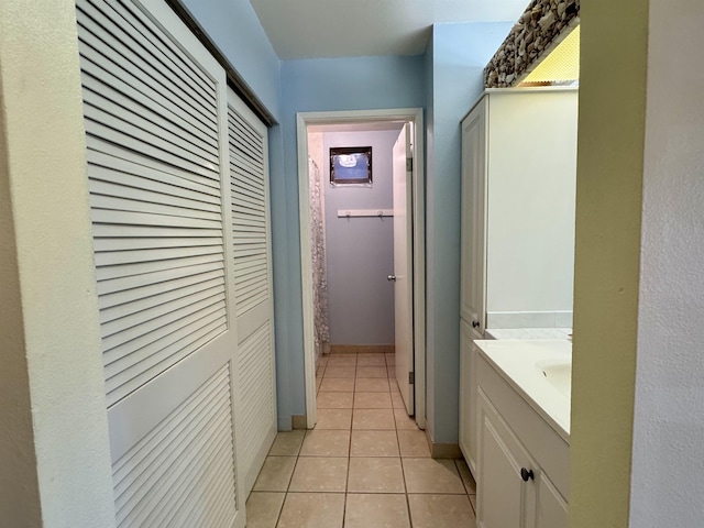 corridor with light tile patterned floors