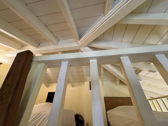 additional living space featuring beam ceiling and wooden ceiling