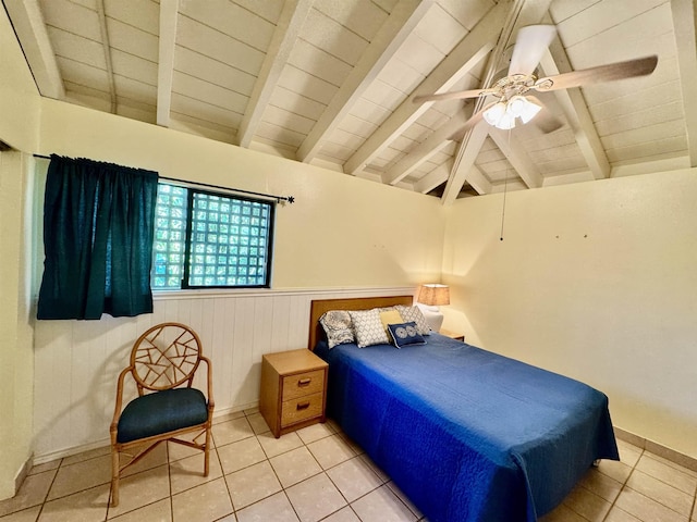 tiled bedroom featuring vaulted ceiling with beams and ceiling fan