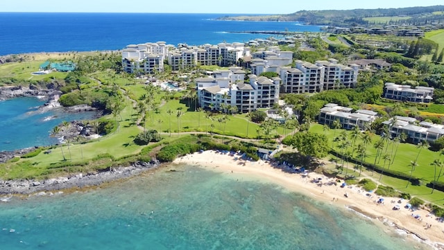 birds eye view of property with a view of the beach and a water view