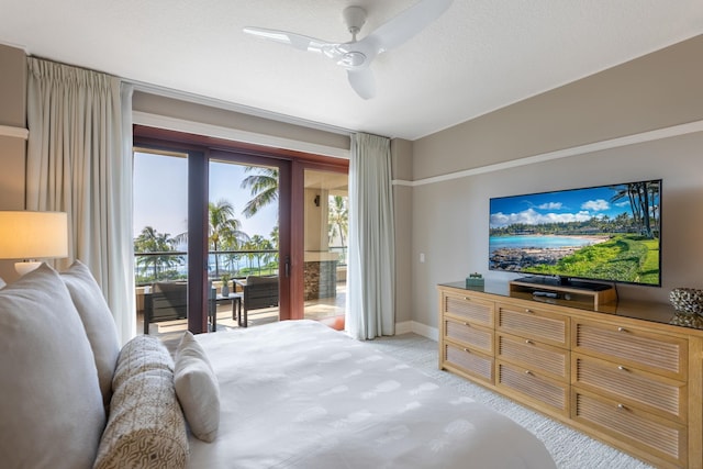 bedroom featuring light colored carpet, ceiling fan, baseboards, and access to outside