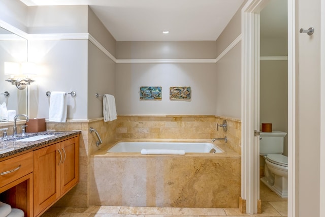 full bath featuring toilet, a bath, vanity, and tile patterned flooring