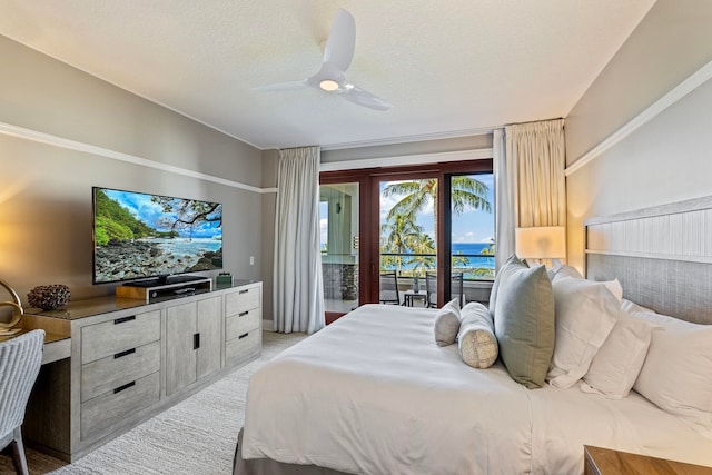 bedroom with access to exterior, a textured ceiling, light carpet, and ceiling fan