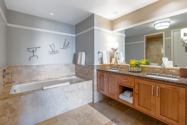 full bathroom featuring double vanity, tiled shower, a bath, and a sink