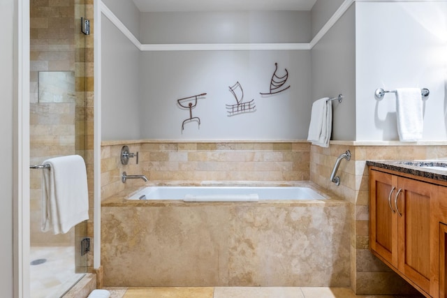 bathroom with tile patterned flooring, a stall shower, vanity, and a garden tub