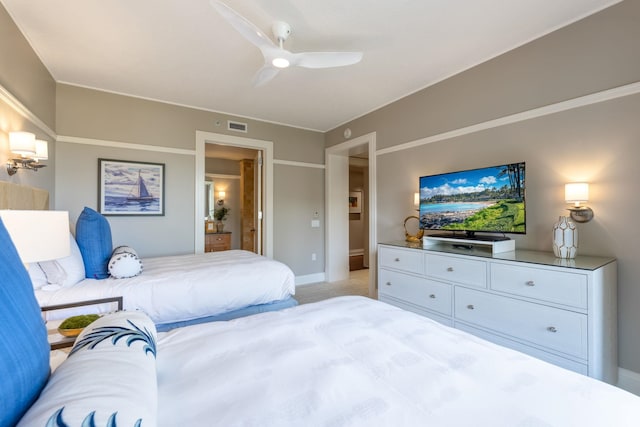 bedroom featuring ceiling fan, visible vents, and light carpet