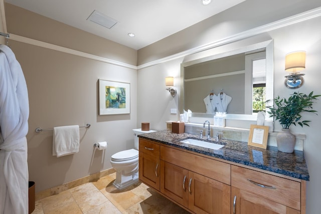 bathroom featuring vanity, visible vents, baseboards, tile patterned flooring, and toilet