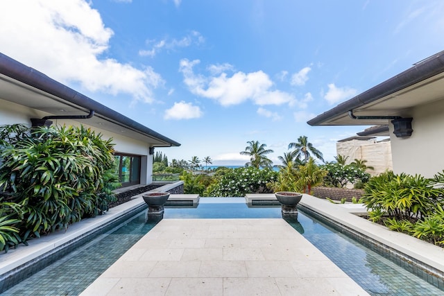 view of pool featuring a patio