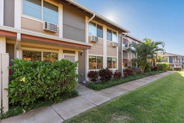 view of property exterior featuring a yard and cooling unit