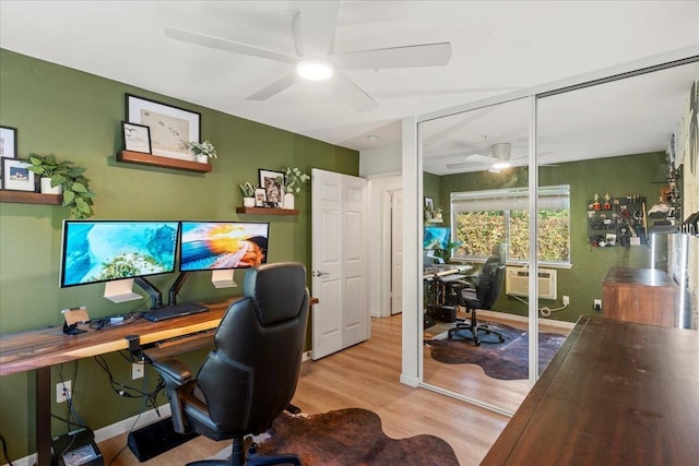 office featuring light hardwood / wood-style flooring and a wall unit AC