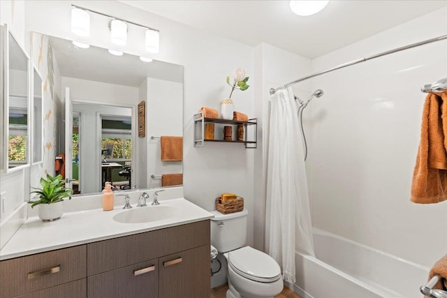 full bathroom featuring vanity, toilet, a wealth of natural light, and shower / bath combo with shower curtain