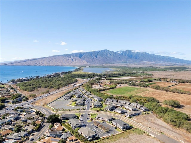 aerial view featuring a water and mountain view