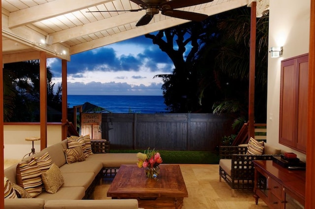 view of patio featuring ceiling fan, an outdoor hangout area, and a water view