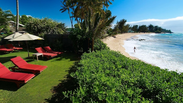 exterior space featuring a view of the beach and a water view