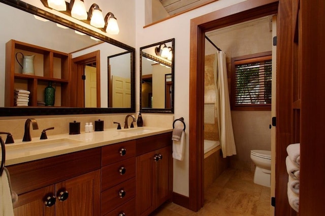 full bathroom with toilet, shower / tub combo, and vanity