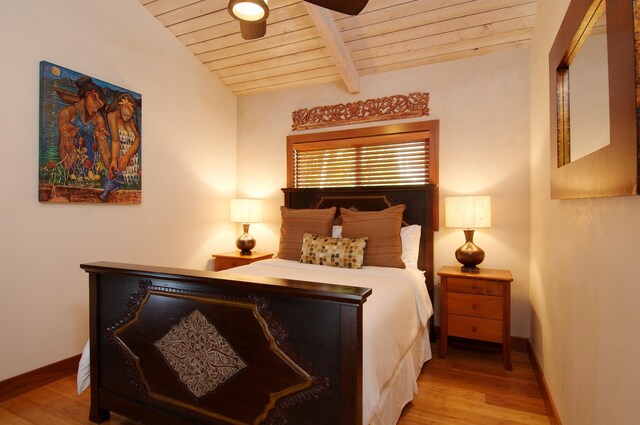 bedroom featuring wooden ceiling, light hardwood / wood-style flooring, vaulted ceiling with beams, and ceiling fan