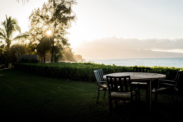 yard at dusk with a water view