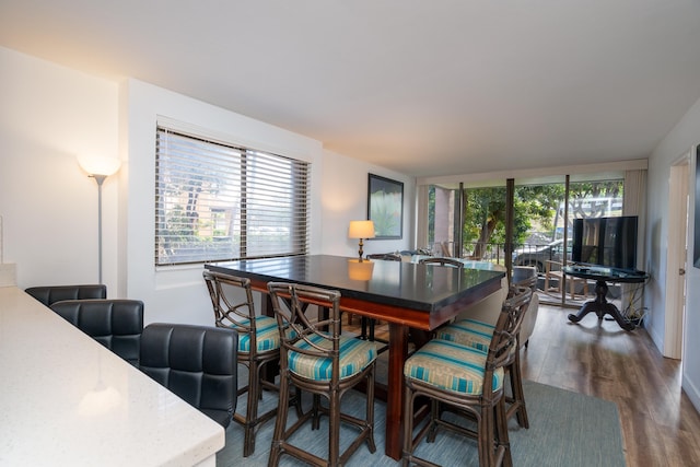 dining room with dark wood-type flooring