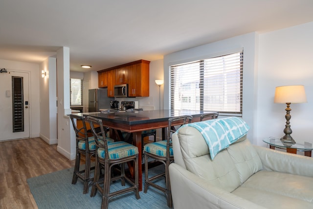 dining space featuring dark hardwood / wood-style flooring