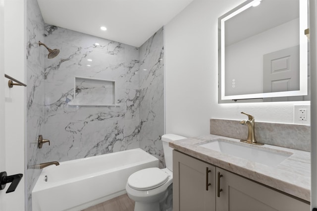 bathroom featuring toilet, vanity, shower / washtub combination, and recessed lighting