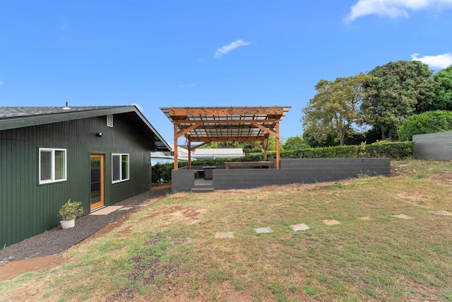 view of yard with a pergola and fence