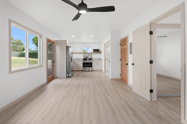 unfurnished living room featuring light wood-type flooring, ceiling fan, baseboards, and recessed lighting